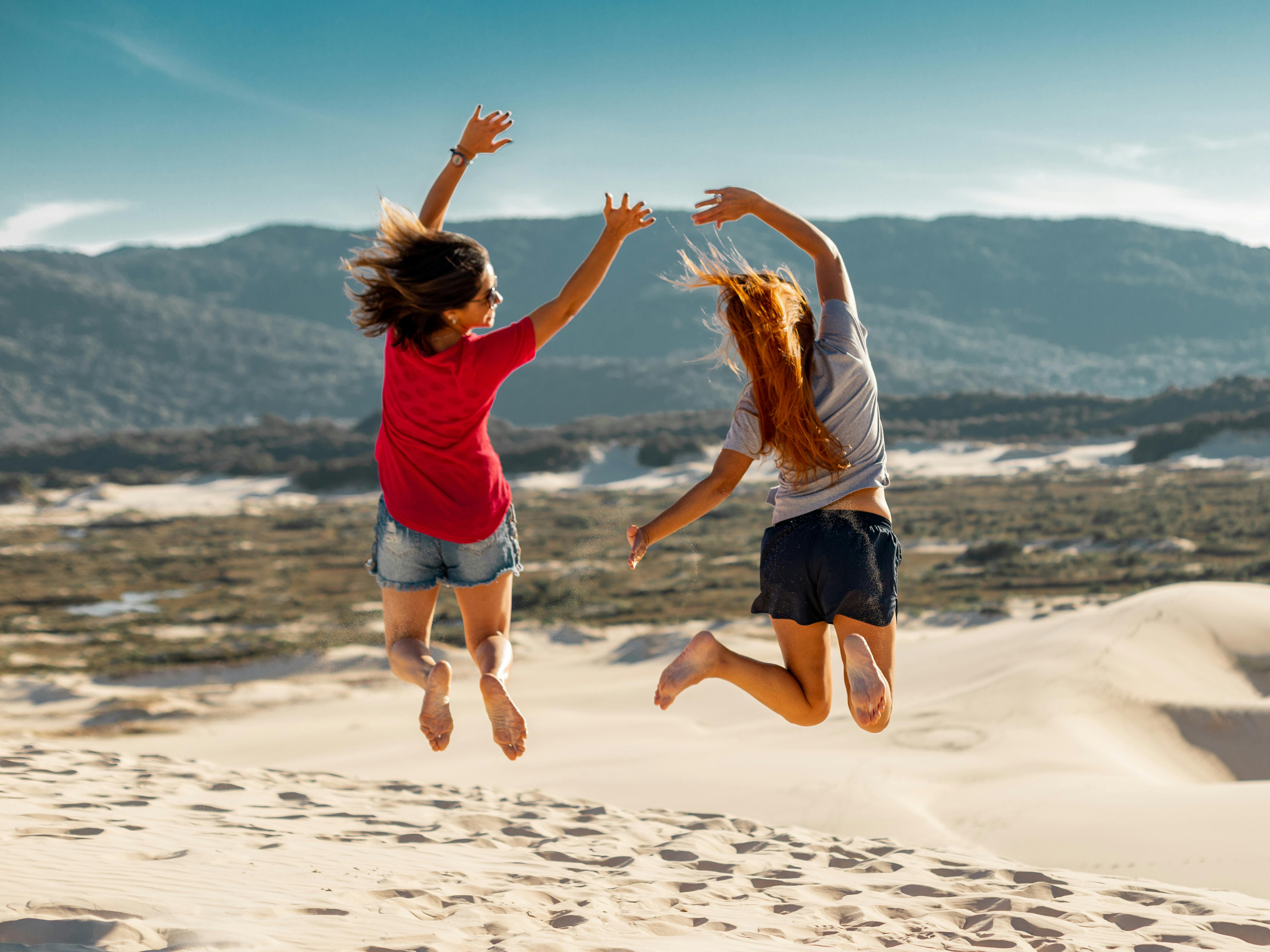 two friends jumping